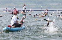 순위 경쟁 없는 한강 3종 축제 개최, 65만 인파 안전과 자발적 참여의 새로운 이정표